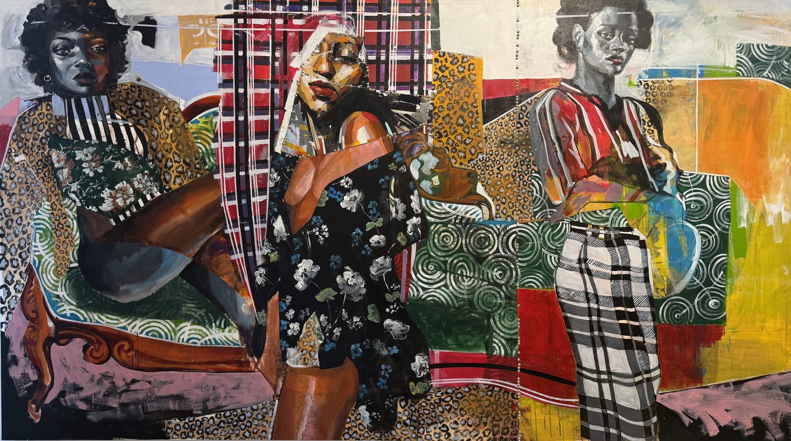 Three figures in patterned dress in a painted interior